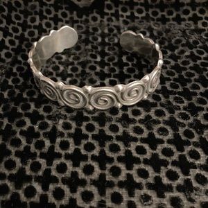 Sterling silver cuff bracelet. Swirl design.